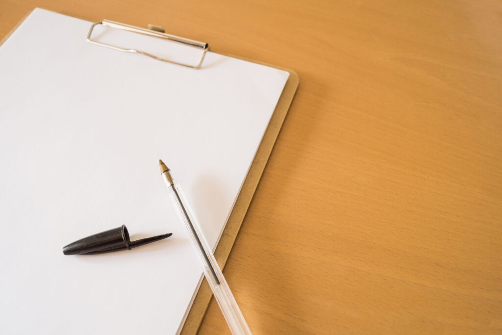 Ball pen clipboard with papers